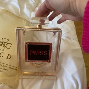 NWOT wjcd brand clearer purse with attachable strap.